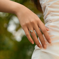 Twisted Elegance: 18K Gold Oval Diamond Ring with Four-Prong Solitaire Design